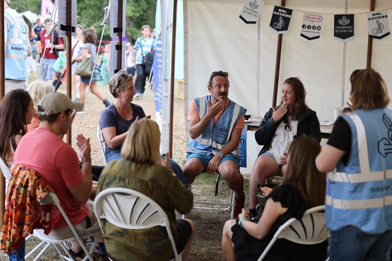 PI volunteers supporting interpreters at a festival